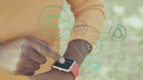 Animation of data processing with network of icons and african american man checking smartwatch. Global connections, data processing, digital interface and computing concept digitally generated image. - Powered by Shutterstock - Get 15% off with code: PIKWIZARD15