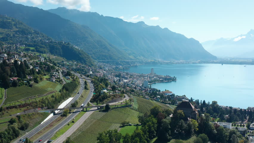 Aerial flight over Montreux City. View to Lake of Geneva and Swiss mountains. Alps Switzerland.