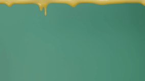 Dripping melted yellow chocolate slow motion in blue background, brown sweet food pouring. Filmed in cinema camera, 8K downscale, 4K. - Powered by Shutterstock - Get 15% off with code: PIKWIZARD15