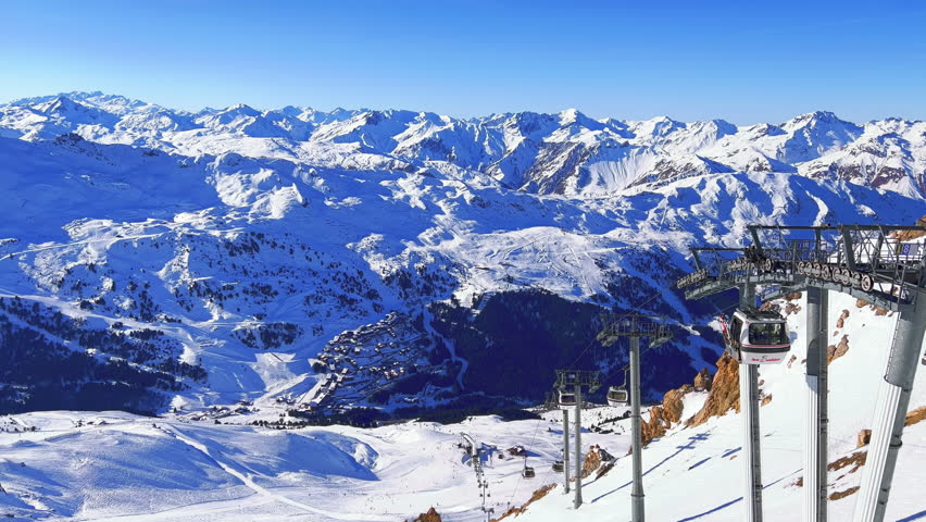 Meribel, France: Panoramic view of French Alps (Savoie Alps), mountains with lot of snow, winter sunny day with clear blue sky in famous ski resort