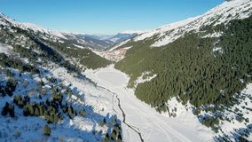 Meribel, France: Aerial view of slopes richly covered with snow, famous ski resort in French Alps (Savoie Alps) mountains in winter - landscape panorama of Europe from above