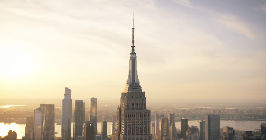 Sunset Aerial View of Empire State Building Spire and a Top Deck Tourist Observatory. New York City Business Center From Above. Helicopter Footage of an Architectural Wonder in Midtown Manhattan Royalty-Free Stock Footage #1106171255