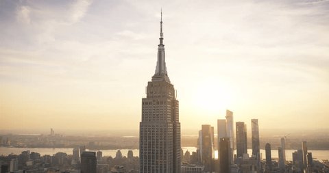 Sunset Aerial View of Empire State Building Spire and a Top Deck Tourist Observatory. New York City Business Center From Above. Helicopter Footage of an Architectural Wonder in Midtown Manhattan Arkivvideo