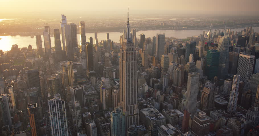 New York City Business Center From Above. Aerial Arc Footage of a Famous Art Deco Skyscraper. Helicopter View on an Impressive Tourist Landmark. Manhattan Panorama with Empire State Building Spire Royalty-Free Stock Footage #1106171259