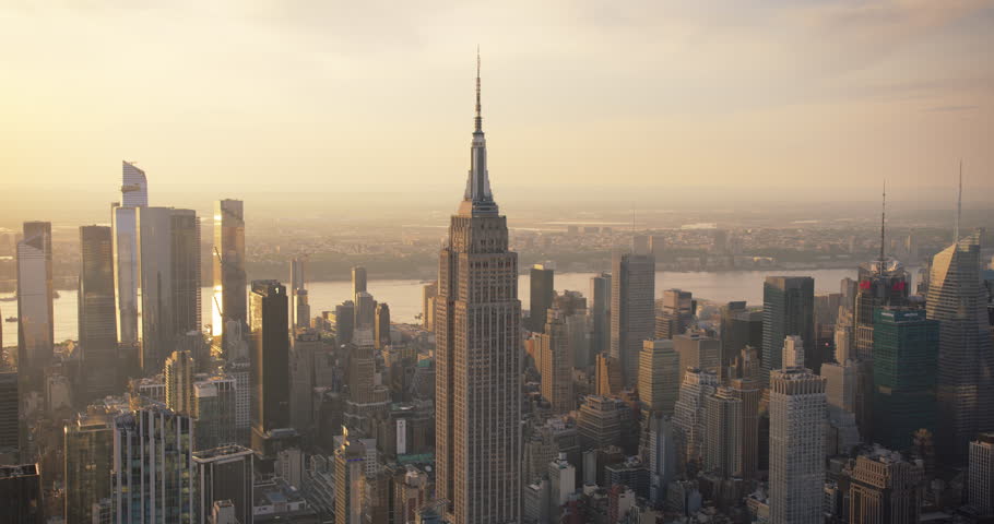 Aerial Footage of New York City and Manhattan Panoramic Skyline with Iconic Empire State Building. Helicopter View of the Cityscape from Above with Towering Tourist Attraction Royalty-Free Stock Footage #1106171269