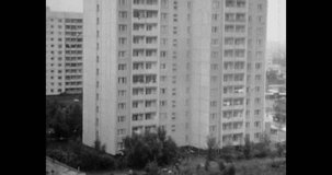 Residential buildings architecture panorama in urban district. Apartment building in city street. Real estate development. Archival vintage black white film. Old retro archive. 1980s Moscow, Russia