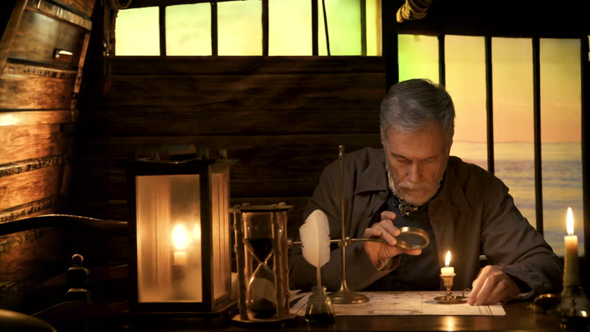 An 18th century scene lit by candlelight of a sailing ship