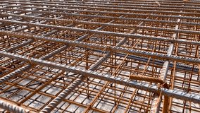 Industrial background. Rebar texture. Rusty rebar for concrete pouring. Steel reinforcement bars. Construction rebar steel work reinforcement. Closeup of Steel rebars. - Powered by Shutterstock - Get 15% off with code: PIKWIZARD15