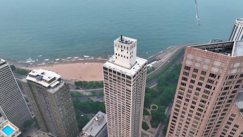 Top down aerial view of residential skyscrapers overlooking Lake Michigan in Chicago, Illinois. Smokey summer day from forest fires.