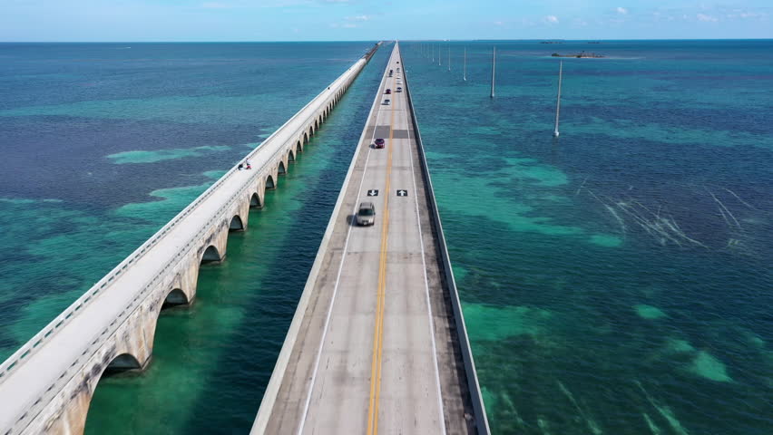 Aerial shot of the Seven Mile Bridge in Florida which connects several of the Florida Keys on the way to Key West Royalty-Free Stock Footage #1106183561