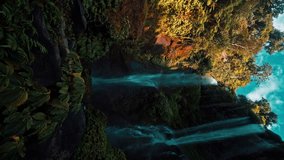 Bali waterfall Sekumpul in tropical rainforest jungle on nature background 4K vertical video