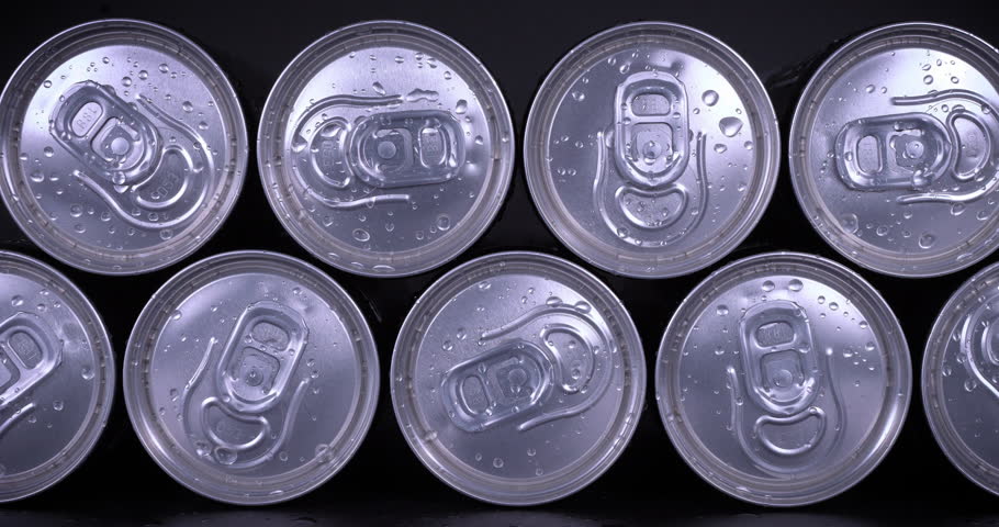 Cooled soda cans ready to drink on black background. Summer drink, thirsty, coke, juice consumption, recycle concept. Dolly shot 4k Royalty-Free Stock Footage #1106199239