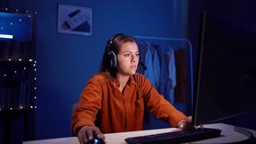 Young confident woman playing online computer video game, broadcast streaming live at home. Gamer lifestyle concept