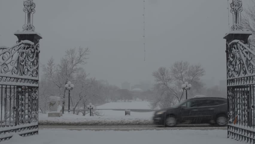 Winter gates with someone walking by