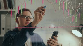 A professional, project expert keeps looking at the screen of a modern smartphone in a creative office. young professional manipulating data on transparent screen applying new scheduling methods - Powered by Shutterstock - Get 15% off with code: PIKWIZARD15