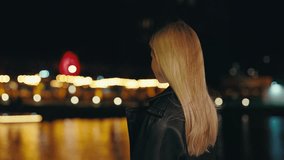 Back View of the Long-Haired Blonde Woman Standing Outside in the Night Near Lake, Looking Away, Dreaming, Thinking. Lonely, Urban, Dramatic, and Freedom Concept - Powered by Shutterstock - Get 15% off with code: PIKWIZARD15