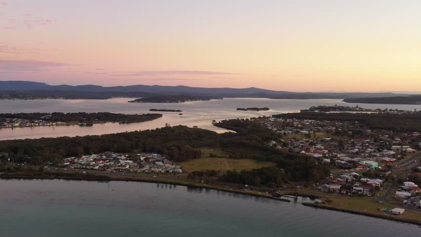 Swansea town at Lake Macquarie Pacific coast of Australia in aerial 4k pan.
 Royalty-Free Stock Footage #1106221745