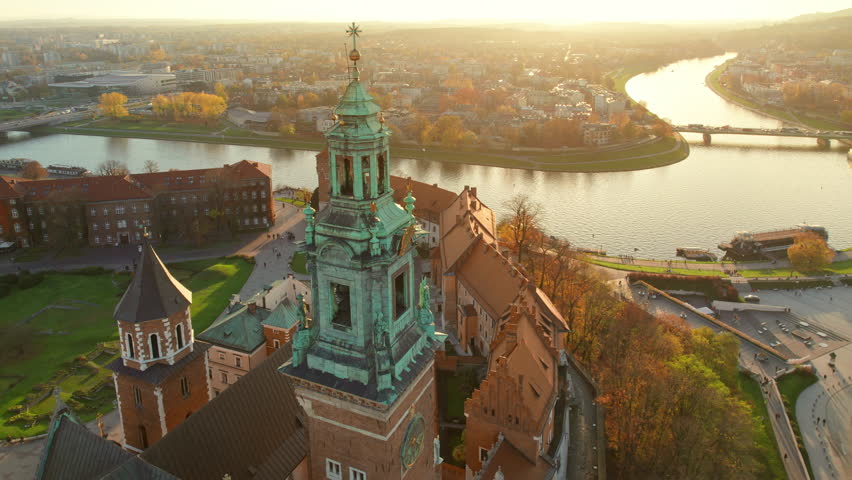 Historic royal Wawel Castle in Krakow at sunset, Poland. Aerial view of the historical courtyard, Cathedral, Sandomierz Tower and defensive walls of the Wawel Castle. The travel landmark of Krakow. Royalty-Free Stock Footage #1106235357