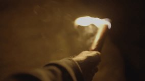 Male Adventurer Exploring Stone Rock Cave in Darkness Outside Using Torch Light - Powered by Shutterstock - Get 15% off with code: PIKWIZARD15