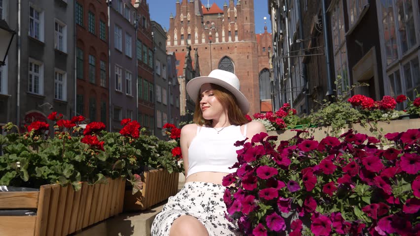 girl in a white hat on the background of Gdansk Europe Poland
