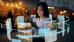 An incredibly beautiful Asian woman is using an augmented reality phone to browse web pages, apps, and social networks. Woman uses the gadget while standing in the middle of a city street at night - Powered by Shutterstock - Get 15% off with code: PIKWIZARD15