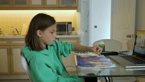 Girl painting at home. 4k video footage UHD 3840x2160