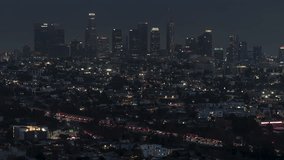 Establishing Aerial View Shot of Los Angeles CA, L.A. California US, perfect clear shot, circling left, superb view of the city, Los Angeles Skyline, Iconic Downtown LA and districts at night evening