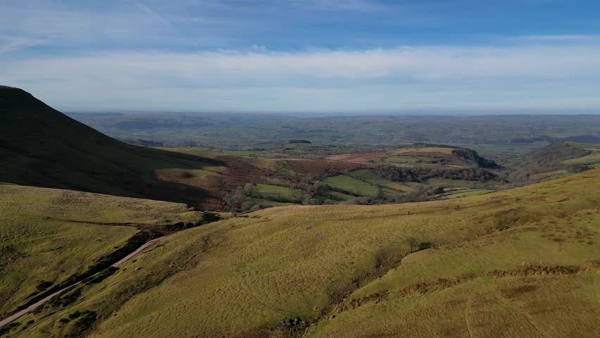 4K Drone video of hikers at Hay Bluff, Lord Herefords Knob, Brecon Beacons National Park, Wales. Near Hay on Wye, Powys in February. Forward motion.