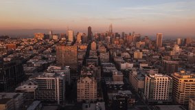 Establishing Aerial View Shot of San Francisco CA, California, United States, America, magical sunset, red and orange, tracking in push in, whole city, San Francisco Skyline