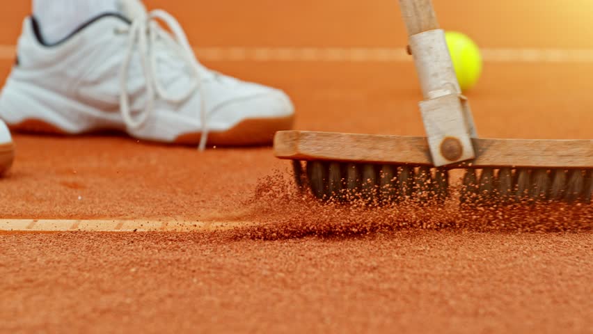 Super slow motion of sweeping tennis court line. Low depth of focus. Filmed on high speed cinema camera, 1000fps. Speed ramp effect.