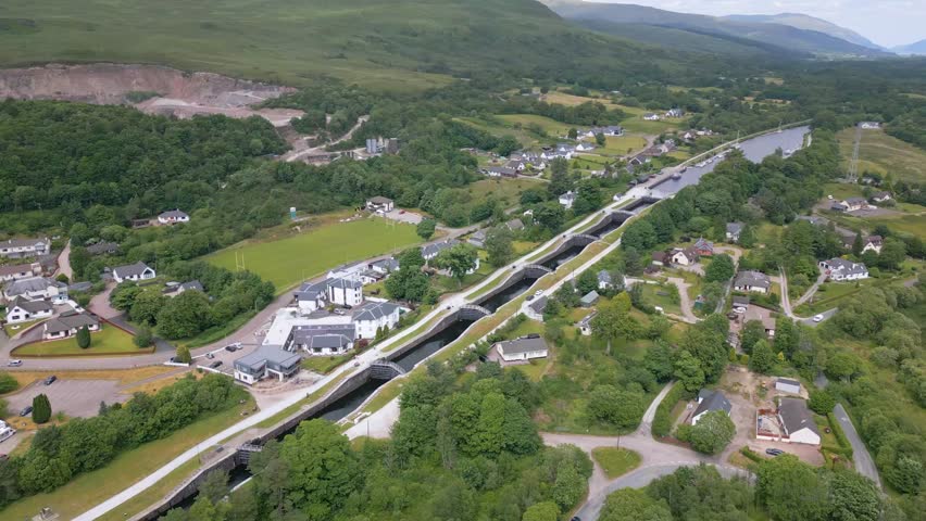 This is an aerial drone shot of the Neptunes stairs. a boat lock in Fort William. a bigger town in Scotland. 