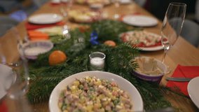 Slow motion Close up shot of friend's celebration dinner table served with tasty meals. holiday party table during christmas - food and drink concept 4k footage