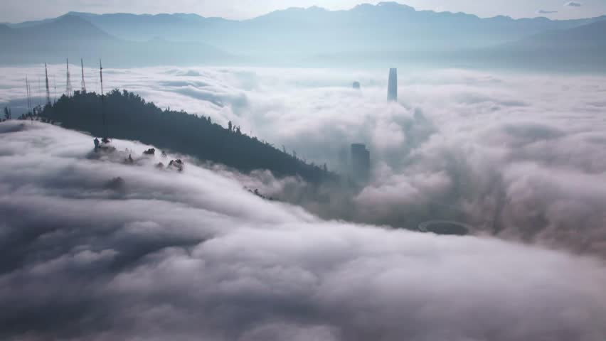 Aerial Drone Above Clouds at San Cristobal Hill Santiago, Chile Virgin Mary Peak and Costanera Neighborhood, Andean Mountain Range Top