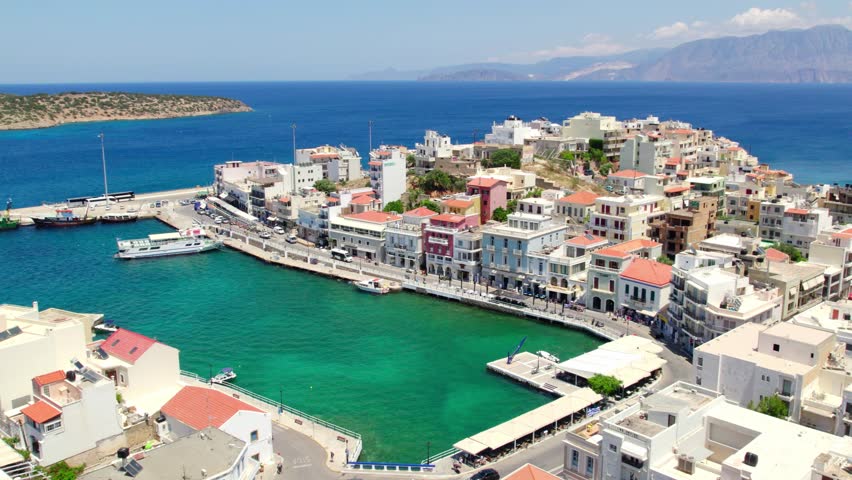 Aerial view of port of Agios Nikolaos, Aegean sea and Greek islands in Crete, Greece Royalty-Free Stock Footage #1106295199