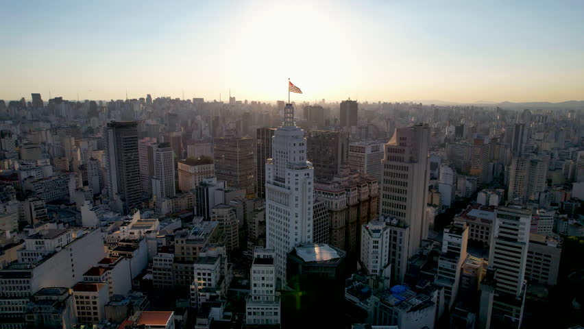 Santander Lighthouse Building. Sunset city of Sao Paulo Brazil. Downtown district at sunset  highrise building. Metropolis landscape of Sao Paulo Brazil. Famous high rise Building of city Sao Paulo.