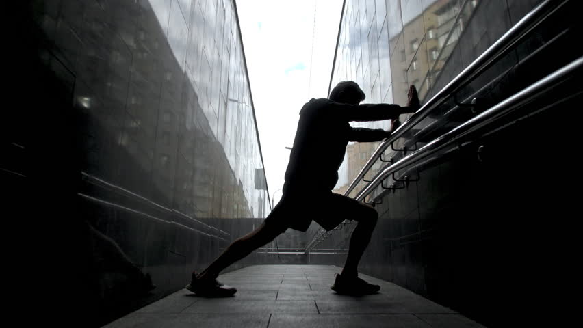 Fitness Runner Cardio Workout Outdoor. Asian Man warm up And Stretching Legs before Running Jog. Athlete Training Exercising In Sportswear Warm-Up at outdoor street. Strength and endurance concept. Royalty-Free Stock Footage #1106304161