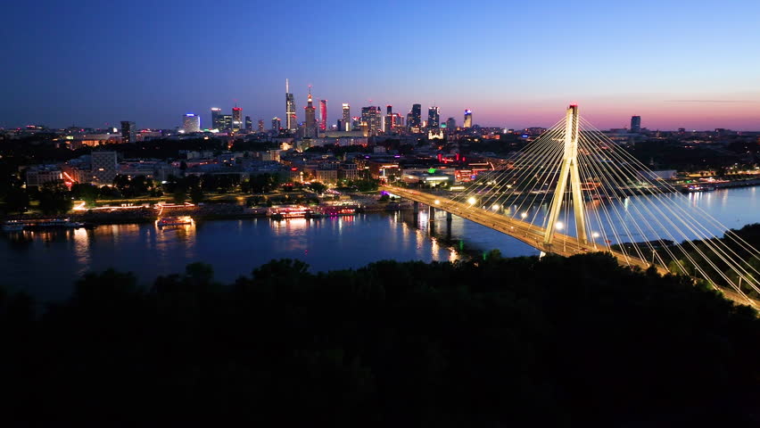 Aerial Poland Warsaw. Aerial view of Downtown City Streets at Night in Business District Cityscape. Aerial view of Warsaw capital city of Poland. 