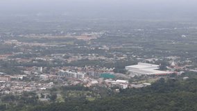 High-angle video background on the mountain, Kho Hong Peak view point overlooking Hat Yai city, condominiums, parks and houses scattered in many places in Songkhla province of Thailand.