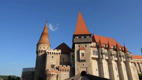 Amazing wide angle 4k video tilt camera movement with the amazing architecture of the medieval Corvin (Hunyad) Castle in Hunedoara. Travel to Romania landmarks.
