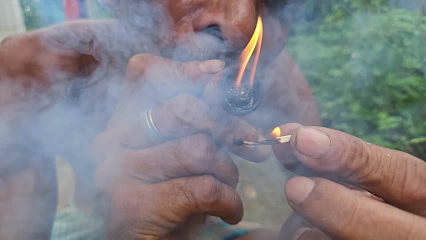 Indian Village People Preparing Marijuana for smoking.