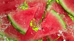 Super Slow Motion Shot of Water Wave Splashing on Watermelon Slices and Ice Cubes at 1000fps. - Powered by Shutterstock - Get 15% off with code: PIKWIZARD15