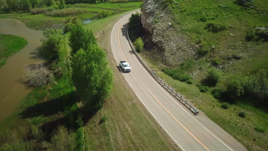 Aerial Backward Shot Of Pickup Truck Moving On Country Road - Billings, Montana