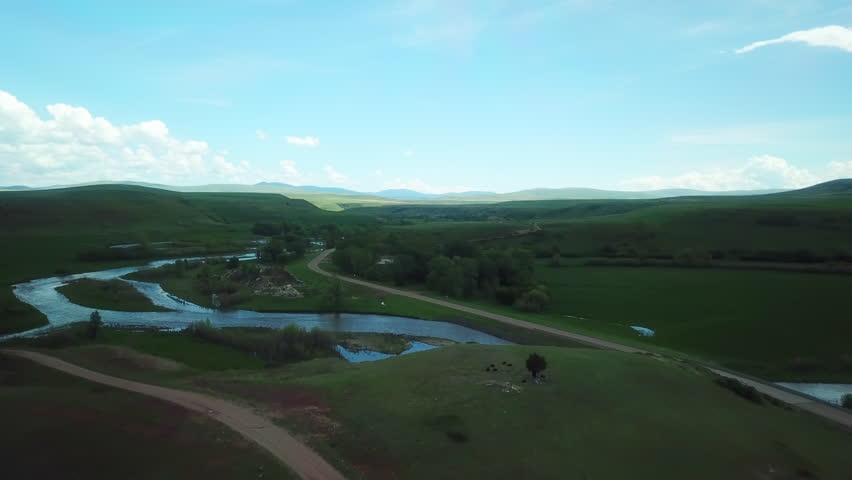 Aerial Slow Motion Shot Of Vehicle Moving On Road By River Against Sky, Drone Flying Over Landscape - Billings, Montana