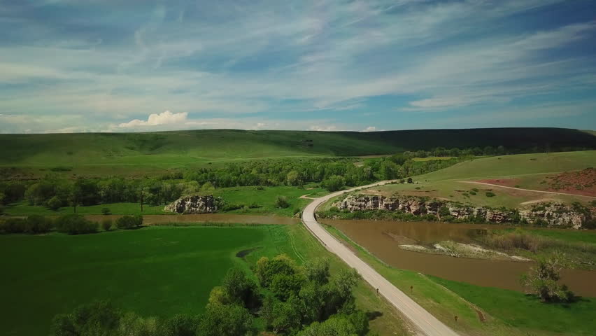 Aerial Shot Of Pickup Truck Moving On Road Passing Through Mountains Against Sky - Billings, Montana