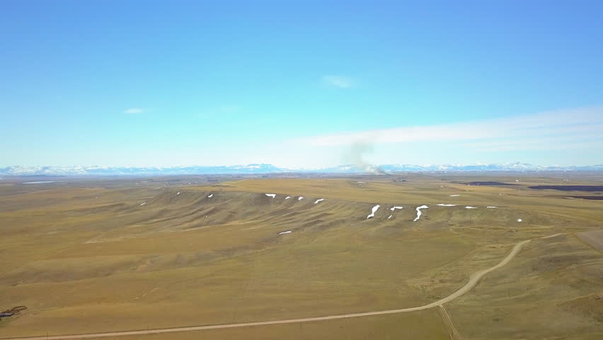 Aerial Backward Shot Of Idyllic Landscape Against Sky On Sunny Day - Billings, Montana