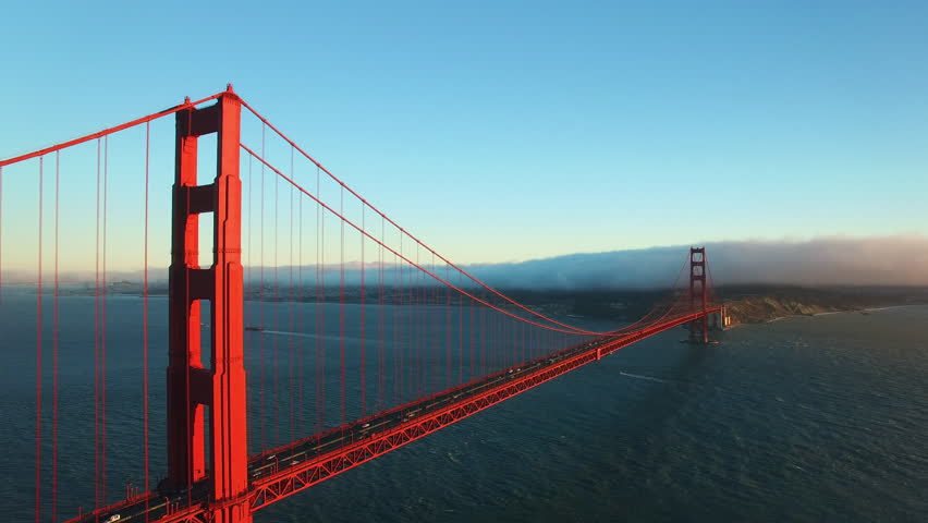 Aerial Shot Of Famous Golden Gate Bridge On Sea Against Sky, Drone Flying Backward Over Landmark Near Mountains - San Francisco, California Royalty-Free Stock Footage #1106324133