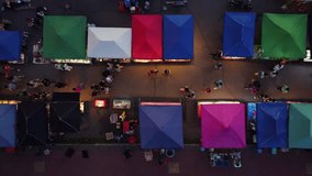 Vibrant Nightlife in Phayao. Aerial Drone View of Bustling People Walking Street and Colorful Night Market. - Powered by Shutterstock - Get 15% off with code: PIKWIZARD15