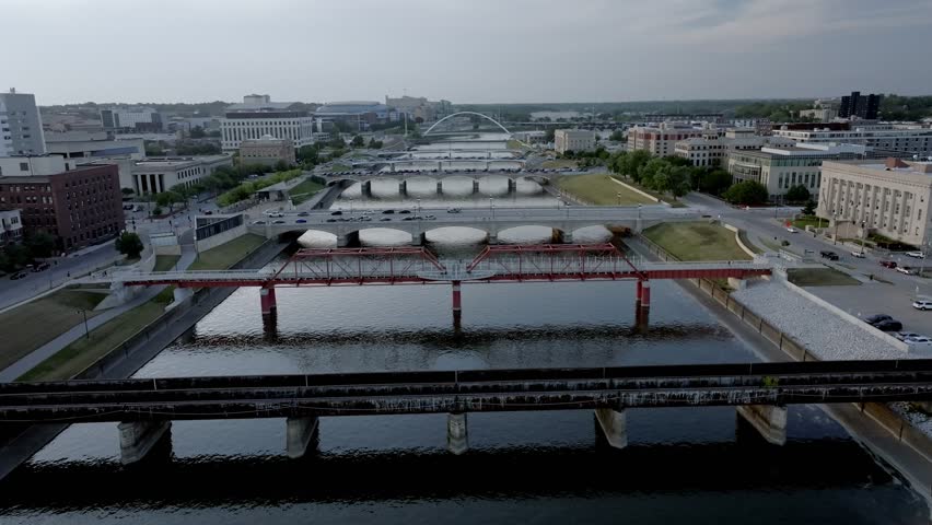 Bridges over Des Moines River in Des Moines, Iowa with drone video moving up.