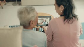 Connected Care: Senior Couple Video Call to Seek Advice from a Female Doctor, Embracing Modern Healthcare Solutions