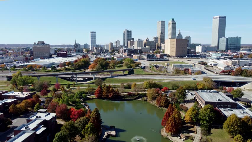 Aerial view of the downtown cityscape and fall color of Veterans Park at Tulsa, Oklahoma